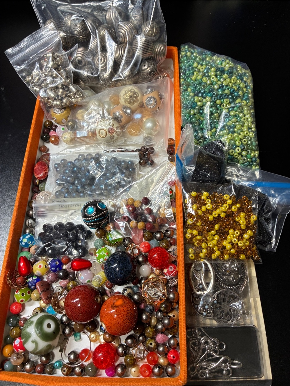 Assorted jewelry making beads and findings for making jewelry assorted materials